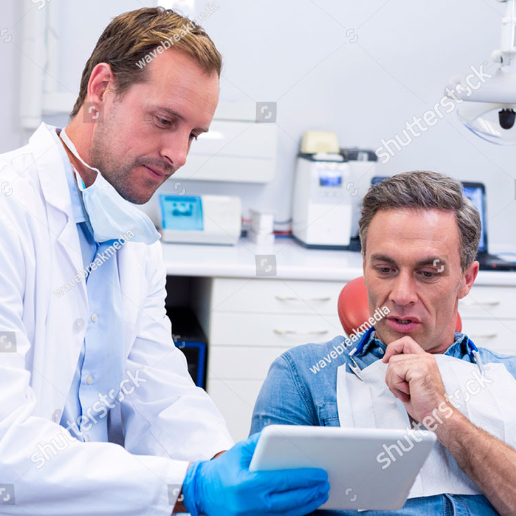 Dentist in dialogue with a patient